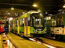 Three-section tram, the centre section has a lower door