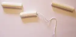 Tampon in plastic applicator