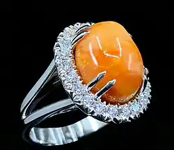 A 10.72 ct. melo pearl, diamond and platinum ring