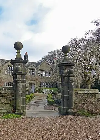 Holdsworth House with wall and gateway to forecourt