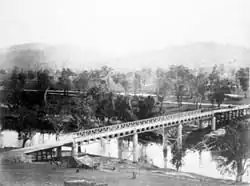 The Prince Alfred bridge crosses the Murrumbidgee River at Gundagai, photographed  1885.