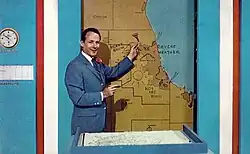 Harry Volkman giving a weather broadcast