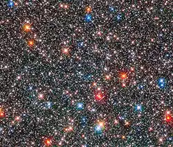 Red giant stars coexist with white, Sun-like stars.[61]
