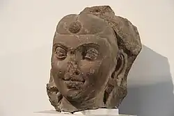 An example of hairstyle with frontal bun, under the Kushans