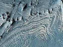 Close view of layers in Candor. Image has been processed in color to bring out more detail. It was named HiRISE picture of the day for November 9, 2023.