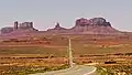 Castle Rock left, King-on-his-Throne (center) Brighams Tomb to right. View looking southwest from Highway 163. Forrest Gump was here. (culmination of cross-country running scene)