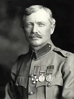 Burnham portrait photograph taken in 1901. He is dressed in his British Army uniform, with major insignia, Distinguished Service Order Cross, British South Africa Medal, and Queens South Africa Medal.