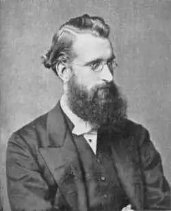 young white male, bearded, in semi-profile