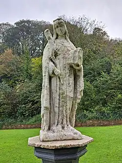 Sculpture of St Winefride near the chapel
