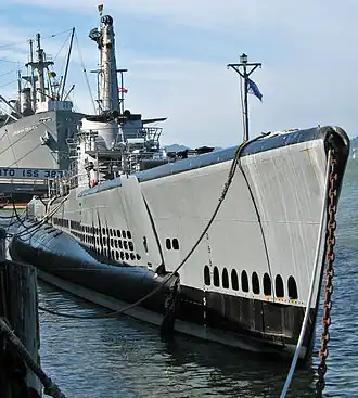 Photograph of the USS "Pampanito" at dock as a museum ship. The Liberty ship SS "Jeremiah O’Brien" is moored in the background.