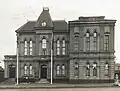 The first Town Hall showing trophy gun and 1892 Frederick St side addition, 11 September 1921.