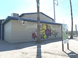 The Grant Park Pool building was built in 1944 as a result of the 1934 Civil Works Administration funding. It is located in the corner of Grant St. and 2nd Avenue. The Pool served the Hispanic community of Phoenix at a time when the usage of public swimming pools was segregated. Grant Park, where the pool is located, is listed in the Phoenix Historic Property Register.