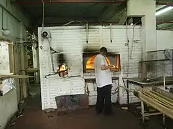 The baker and the oven in baking shemurah matzah in Kfar Chabad