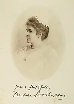 Portrait of Russian Lady facing left with a length of pearls around the neck and signature underneath.