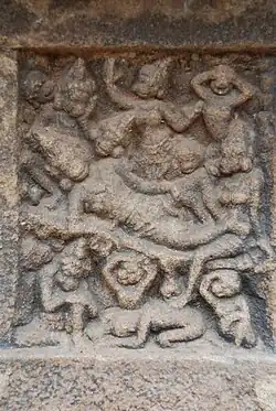Vaali is lying dead, shot by Rama. His wife Tara, son Angadha and brother Sugreeva grieve. The entire clan of monkeys express their grief on Vaali's death. The panel is 6 inches X 6 inches - impressive miniature sculpture