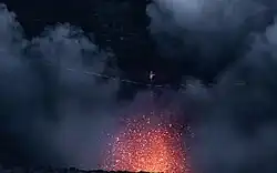 Schulz walking a slackline in front of the erupting volcano Yasur