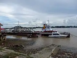 A police boat and jetty in Seikkan Township