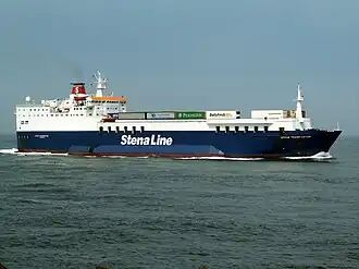 The ship 'Nordic Ferry' has a blue-coloured hull, a white superstructure and a red funnel. White lettering names the operator Stena Line. A number of lorries are visible on the deck. The ship is at sea and making headway.