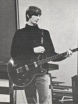Boone playing bass onstage c. 1965