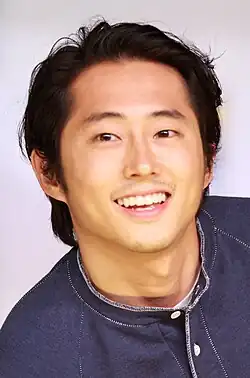 Yeun smiling
