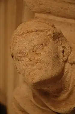 Detail of a capital of the fireplace of the reception room (14th century)