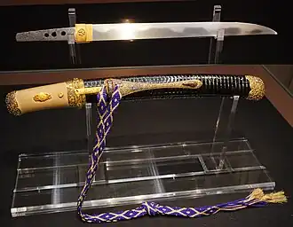 Tantō Hyuga Masamune with Edo period koshirae (mounting) and kumihimo cord; blade: Kamakura period. National Treasure, Mitsui Memorial Museum.