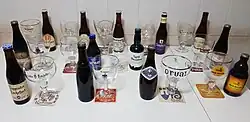 Thirteen trappist beers and their glasses.