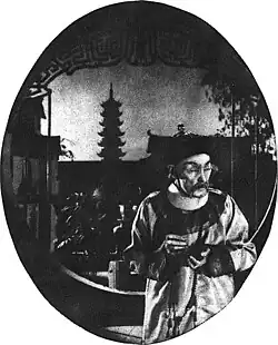 Black and white film still showing a man in Asian period costume