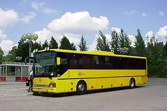 Yellow regional bus at Bålsta station.