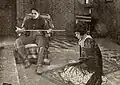 Still for the Exhibitors Herald showing a scene with Olga Grey, William Russell, and Lule Warrenton