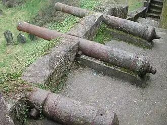 Remains of a post-medieval cannon battery, mounted on a medieval town wall, although without carriages.