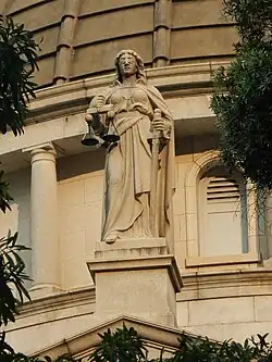 Statue of Themis, the goddess of justice, standing on the building of the Court of Final Appeal