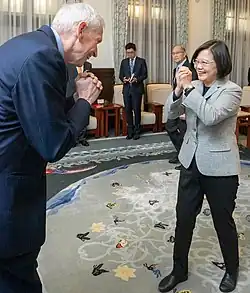 The fist-and-palm is used during the COVID-19 pandemic by government officials in Taiwan as an alternative to handshake.[6]
