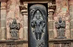 Shiva flanked by Brahma (left) and Vishnu