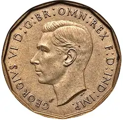 Brass coin showing bust of a man