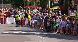 A large crowd of people by the side of a road