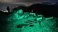 A TAF Special Forces Sniper engages long range targets at night with a Remington Mk 21 Precision Sniper Rifle at the International Specialty Training Center (ISTC) Alpine Sniper Course, in Hochfilzen training area, Austria