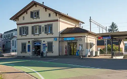Three-story building with gabled roof