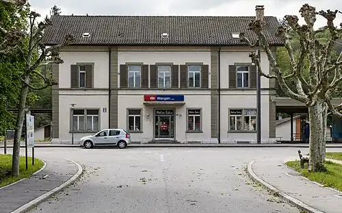Two-story building with gabled roof