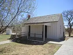 Box and strip house (1903, 1907), with dual entrances but uninsulated, was relocated to the NRHC from Martin County.