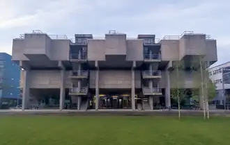 A large, imposing concrete building viewed from the front.