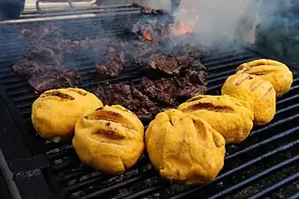 Bulz and pastramă on a grill