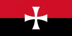 The first flag of the Canadian Nationalist Party. It is a red (top) and black (bottom) bicolour charged with a white Templar cross in the centre.