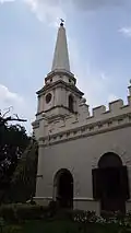 St. Mary’s Church with tablets laid on the ground and enclosed by a compound and a buried wall.