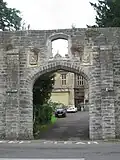 Wall around grounds of Glastonbury Abbey and Abbey Retreat House, including the gate way on Chilkwell Street