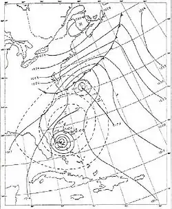 A weather chart on May 18 shows a developing tropical cyclone near the Bahamas.