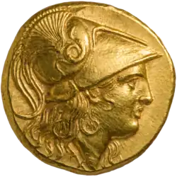 One side of a gold coin of Alexander the Great. The obverse, depicted, shows his profile in armor.