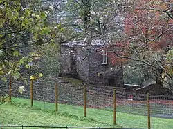 Lady Anne's Bee House in copse to north-east of former stable block at Appleby Castle