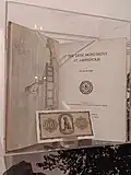 A copy of Broneer's Lion of Amphipolis book and a 1942 Greek 1000 drachma banknote depicting the lion