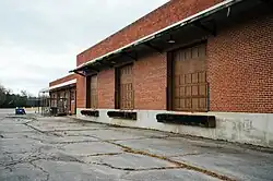 Truck loading docks on a brick train station building